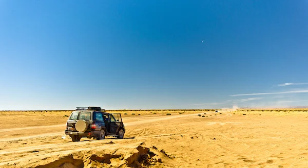 SUV on desert trail