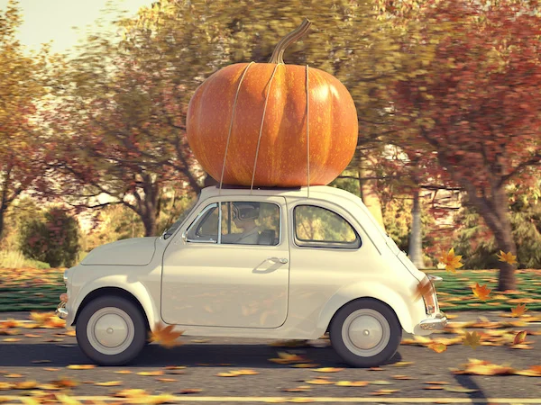 Old car carrying pumpkin